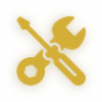 Gold wrench and screwdriver maintenance icon with a soft black-and-gold glow, representing South East Sleepers’ reliable onsite repairs and preventative maintenance for hosts.